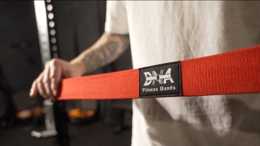 A DNA band stretched under tension, showing the reinforced webbing at the buckle.